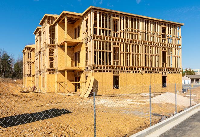 construction zone secured with a temporary fence, marked with warning signs in Emmitsburg MD